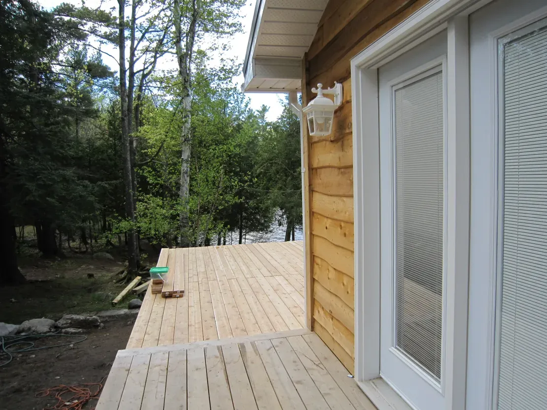 Rustic cabin with wooden deck