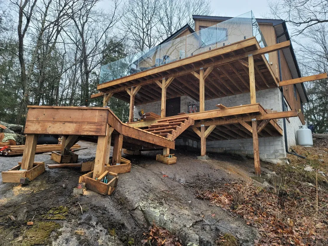 Wooden deck under construction with stairs