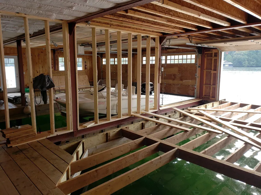 Partially built garage with boat inside