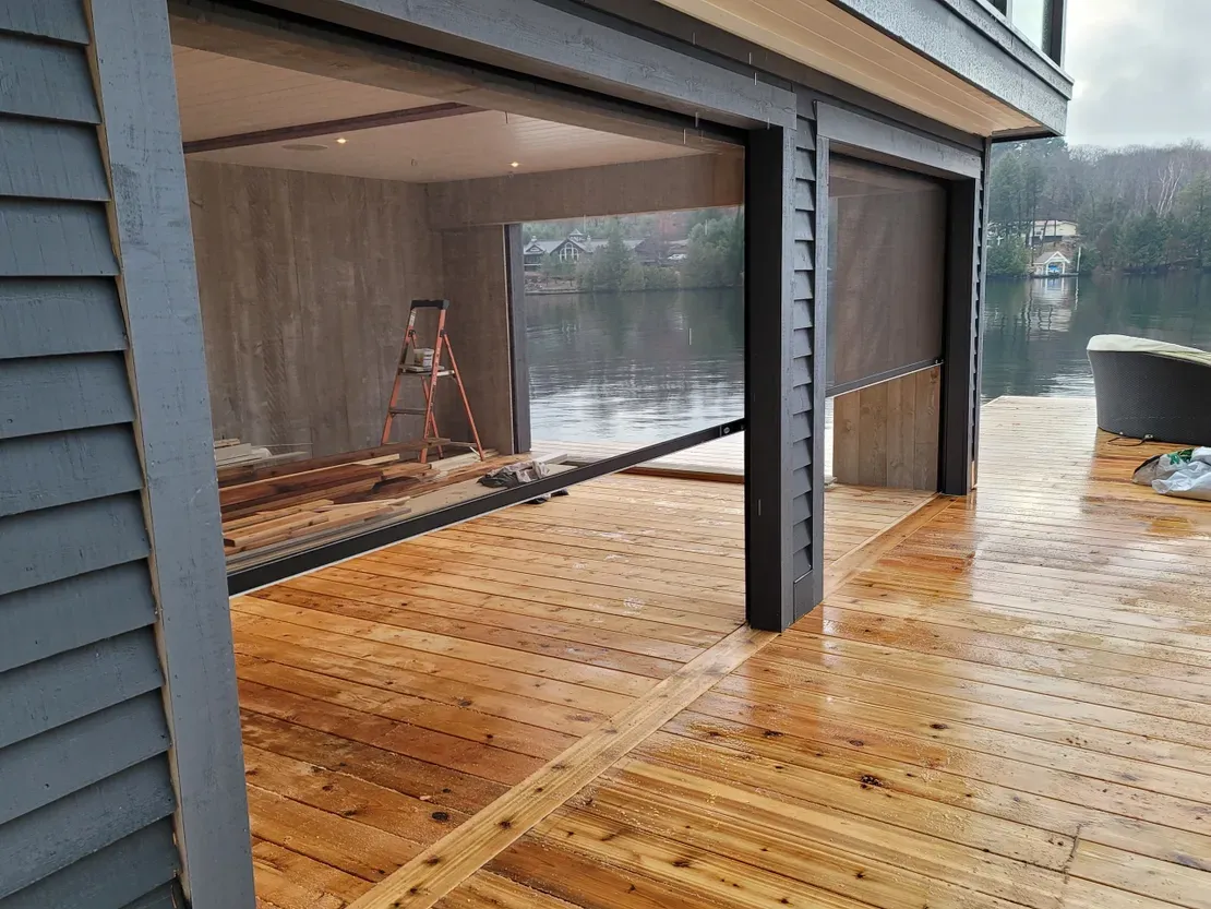 Lakeside house with wooden patio deck
