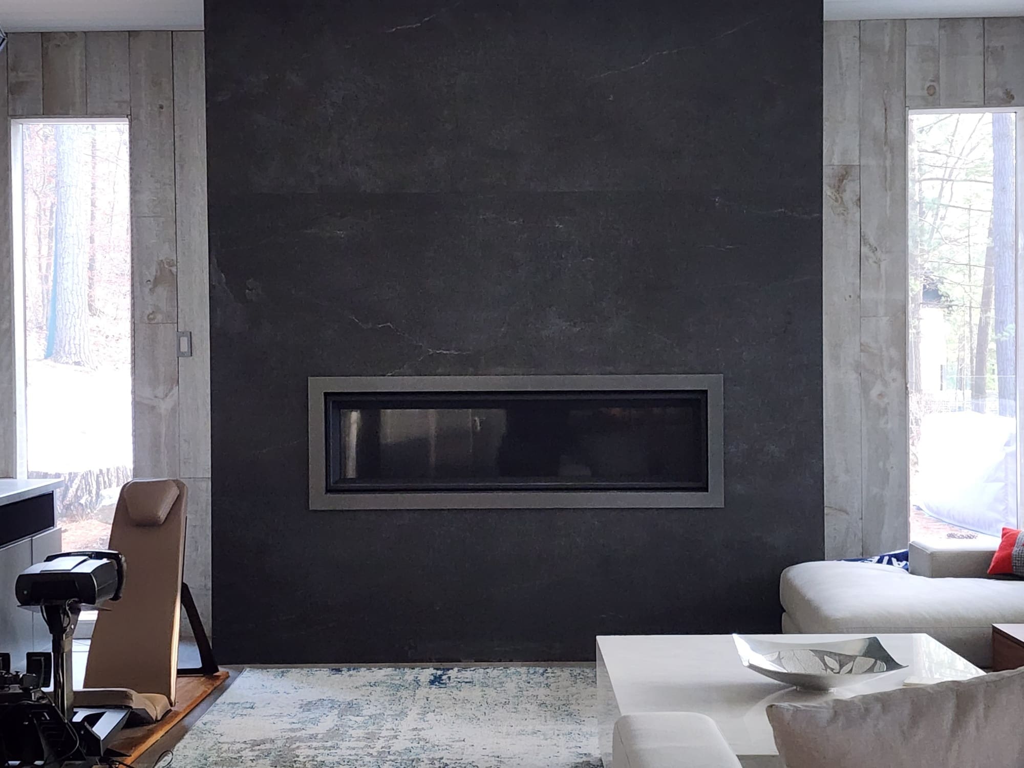 Modern living room with wall-mounted linear fireplace