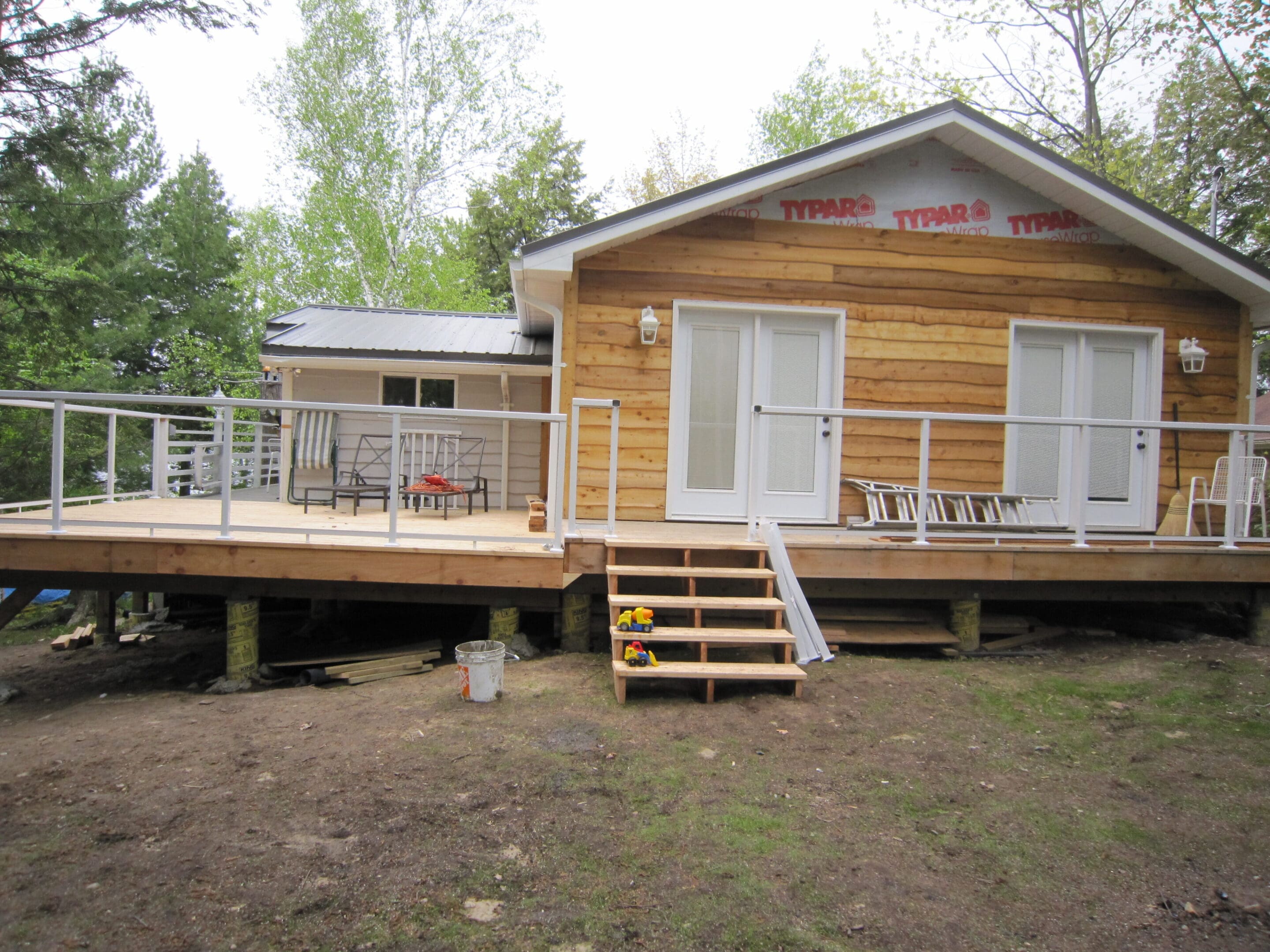 New wooden cabin with deck and stairs